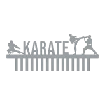 A laser-cut steel wall hanger featuring the word 'KARATE' with three karate figures in action. One figure is performing a high kick, another is in a low stance, and the third is in a defensive position. Below the word is a set of vertical bars for hanging items, set against a black background.